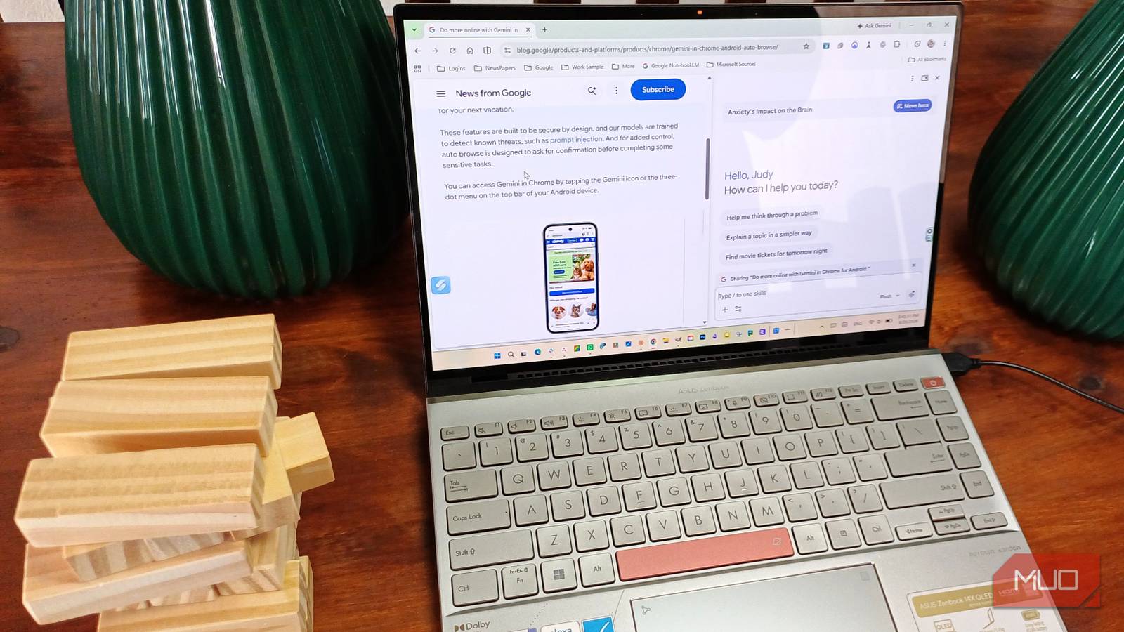 ASUS Zenbook on wooden table with wooden blocks to the side with Google Gemini on the display