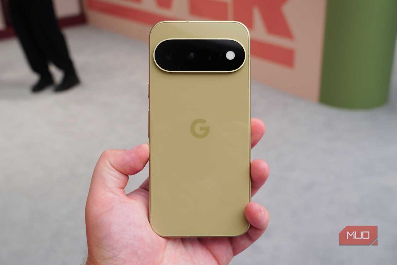 The base Pixel 11 in the Pistachio colorway in the hand.