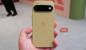 The base Pixel 11 in the Pistachio colorway in the hand.