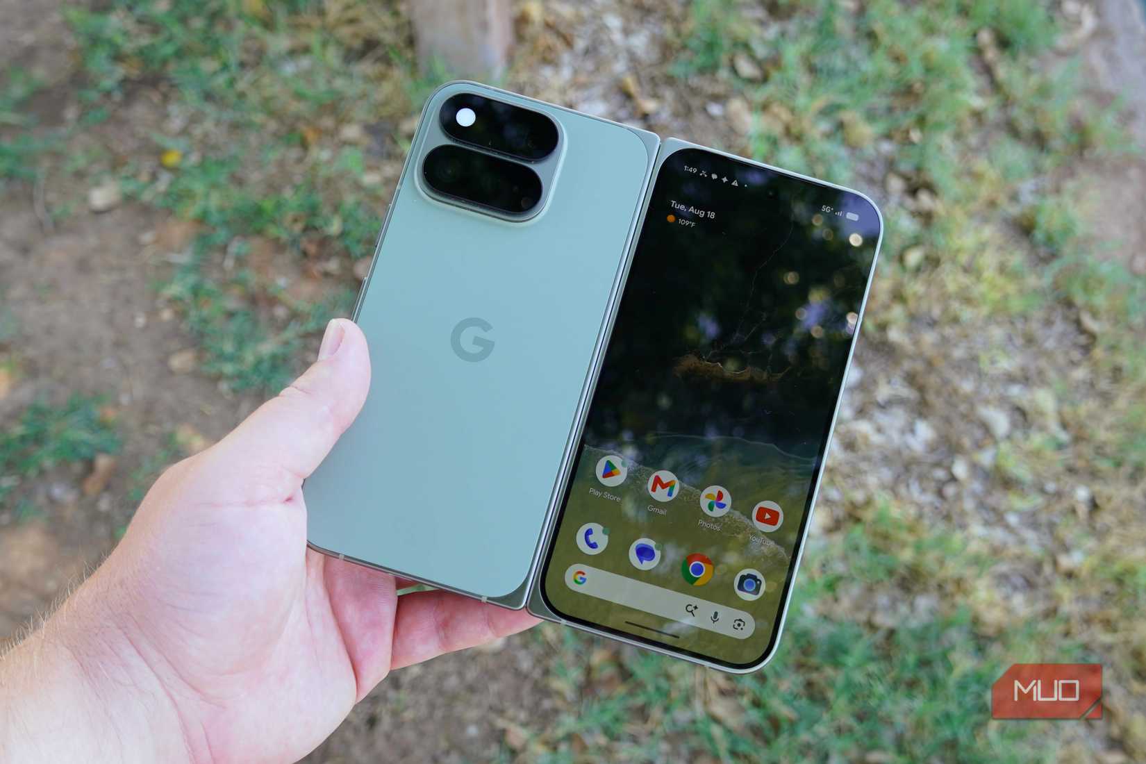 The Pixel 11 Pro Fold unfolded with the cover display active in the hand.
