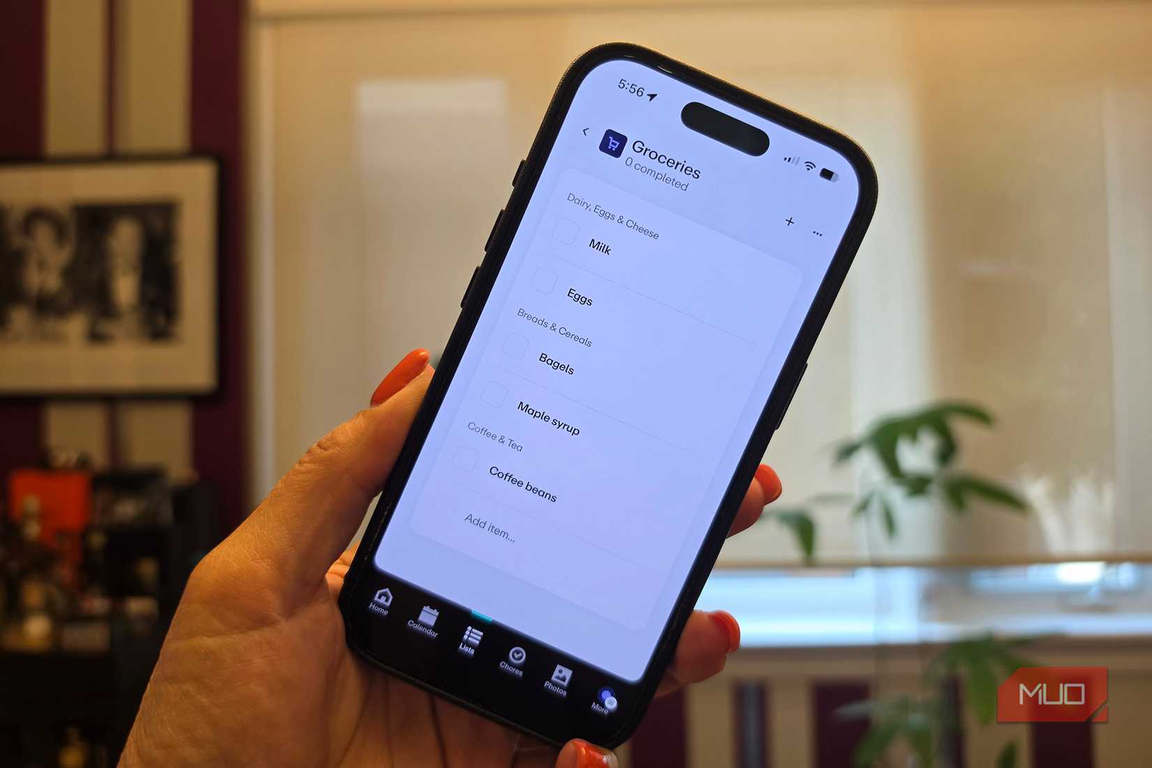 An iPhone showing the Greenlight app with a grocery list.