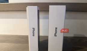 An old iPhone box beside a newer one.
