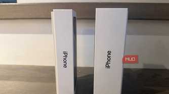 An old iPhone box beside a newer one.