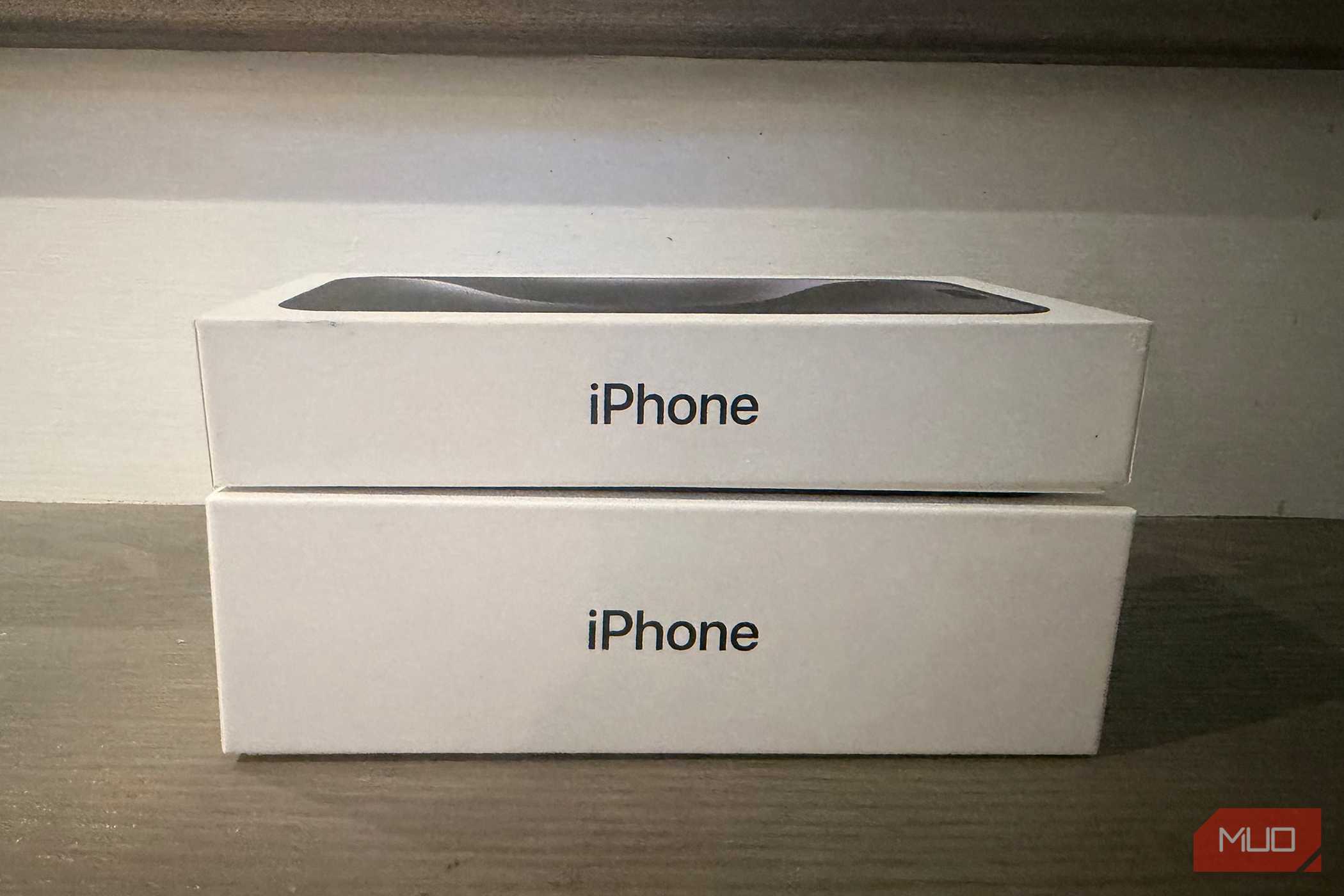 An old iPhone box under a newer one.