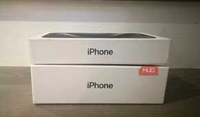 An old iPhone box under a newer one.