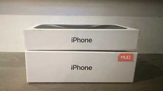 An old iPhone box under a newer one.