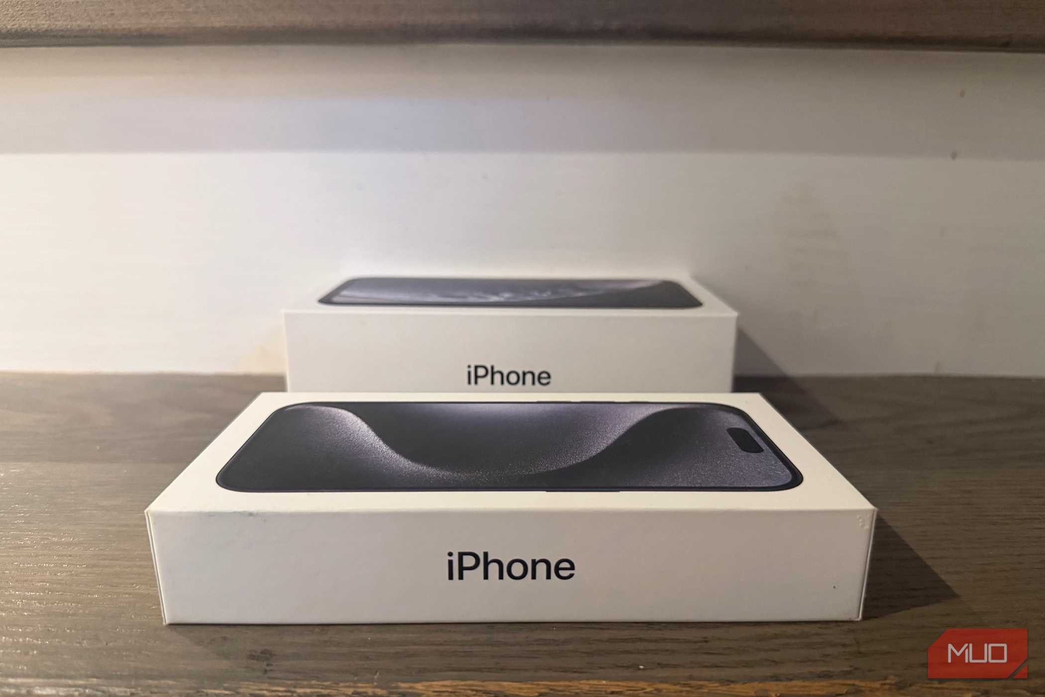 An old iPhone box beside a newer one.