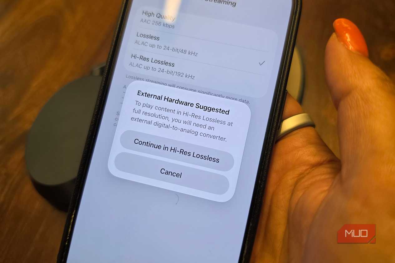 An iPhone with a pop-up showing that you need external hardware to listen in Hi-Res Lossless.