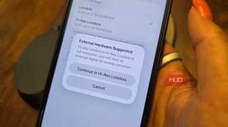 An iPhone with a pop-up showing that you need external hardware to listen in Hi-Res Lossless.