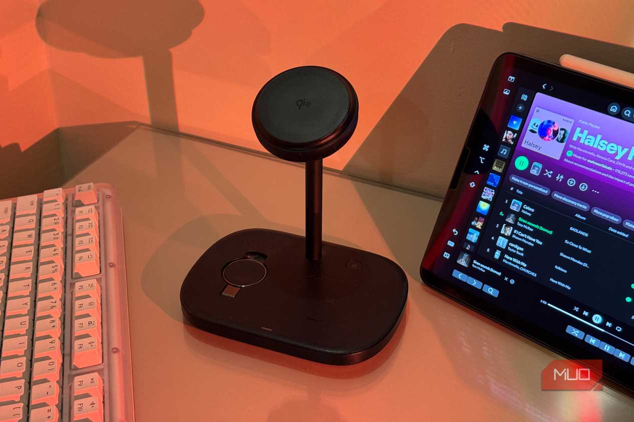 iPhone on Baseus stand with AirPods charging and iPad Spotify 1