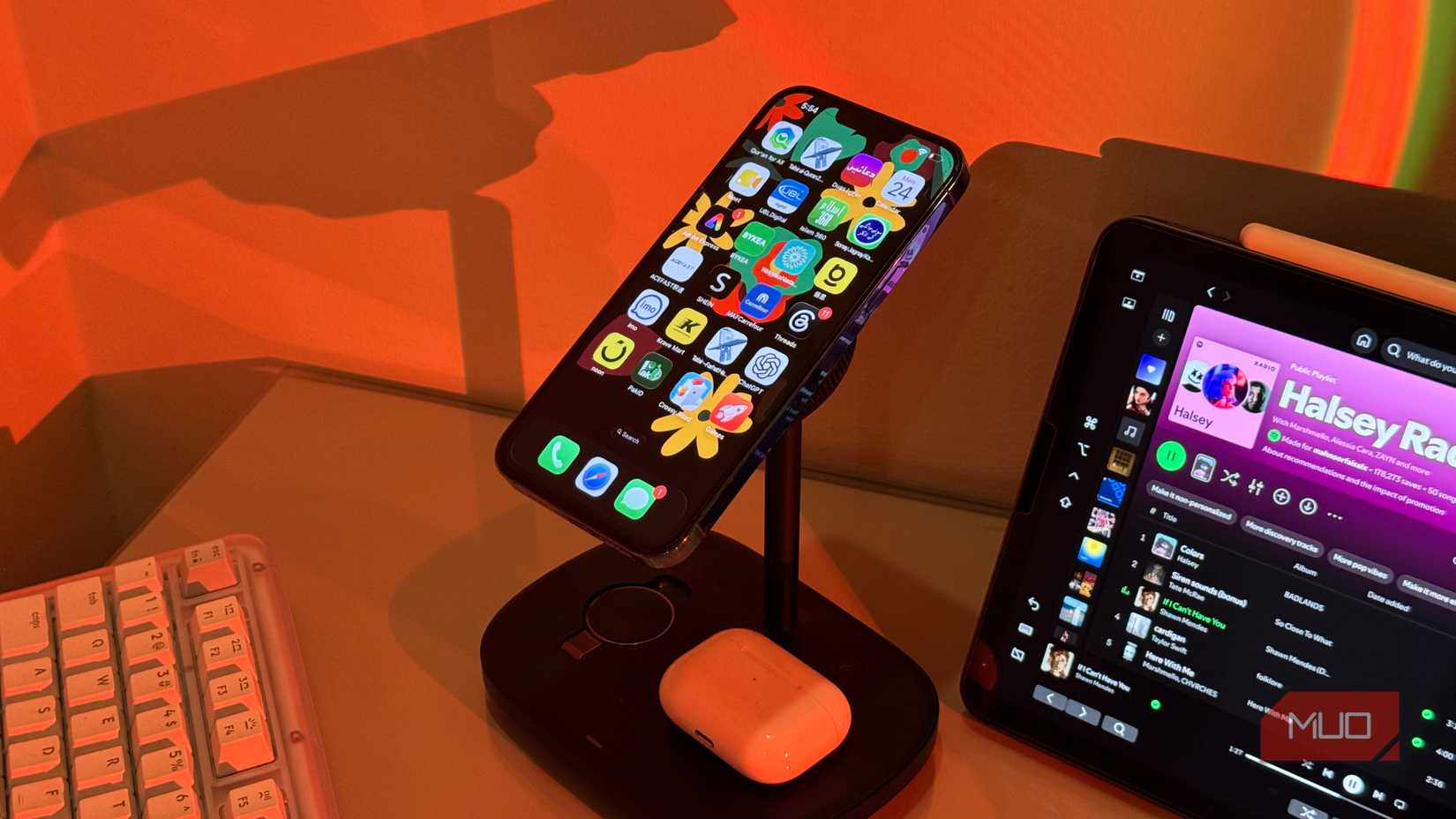 iPhone with Arabic apps on Baseus stand and AirPods 1