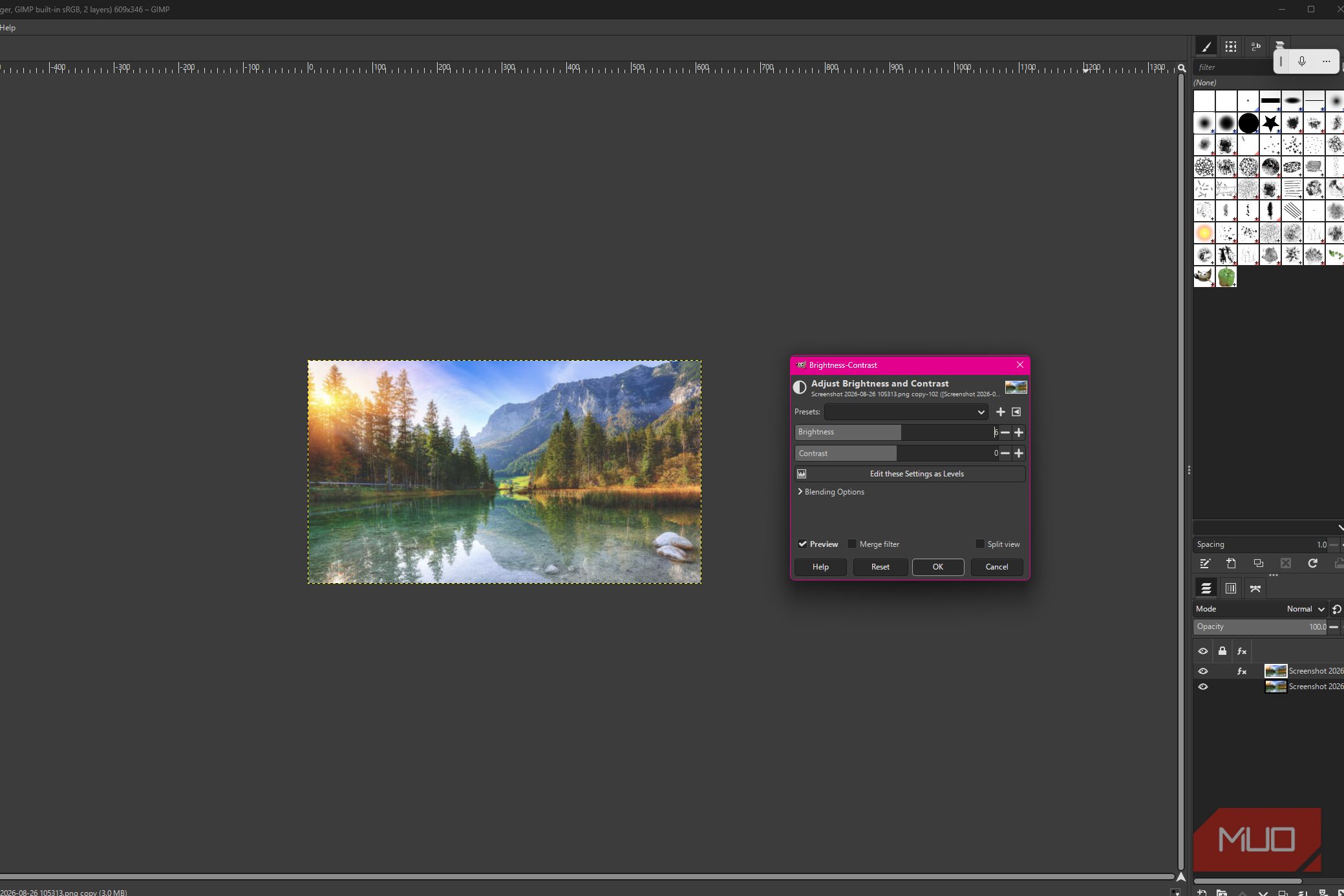 GIMP showing brightness-Contrast adjustments applied to the duplicate lake photo layer while the original remains underneath