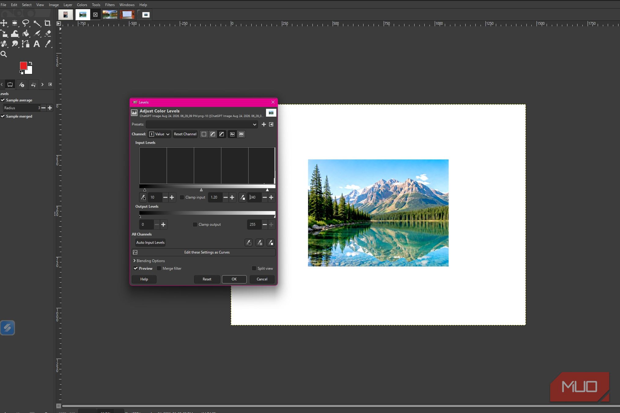 GIMP showing Levels adjustments applied to brighten the mountain lake photo and bring out more detail