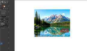 GIMP showing the finished mountain lake photo after the Levels adjustments have been applied