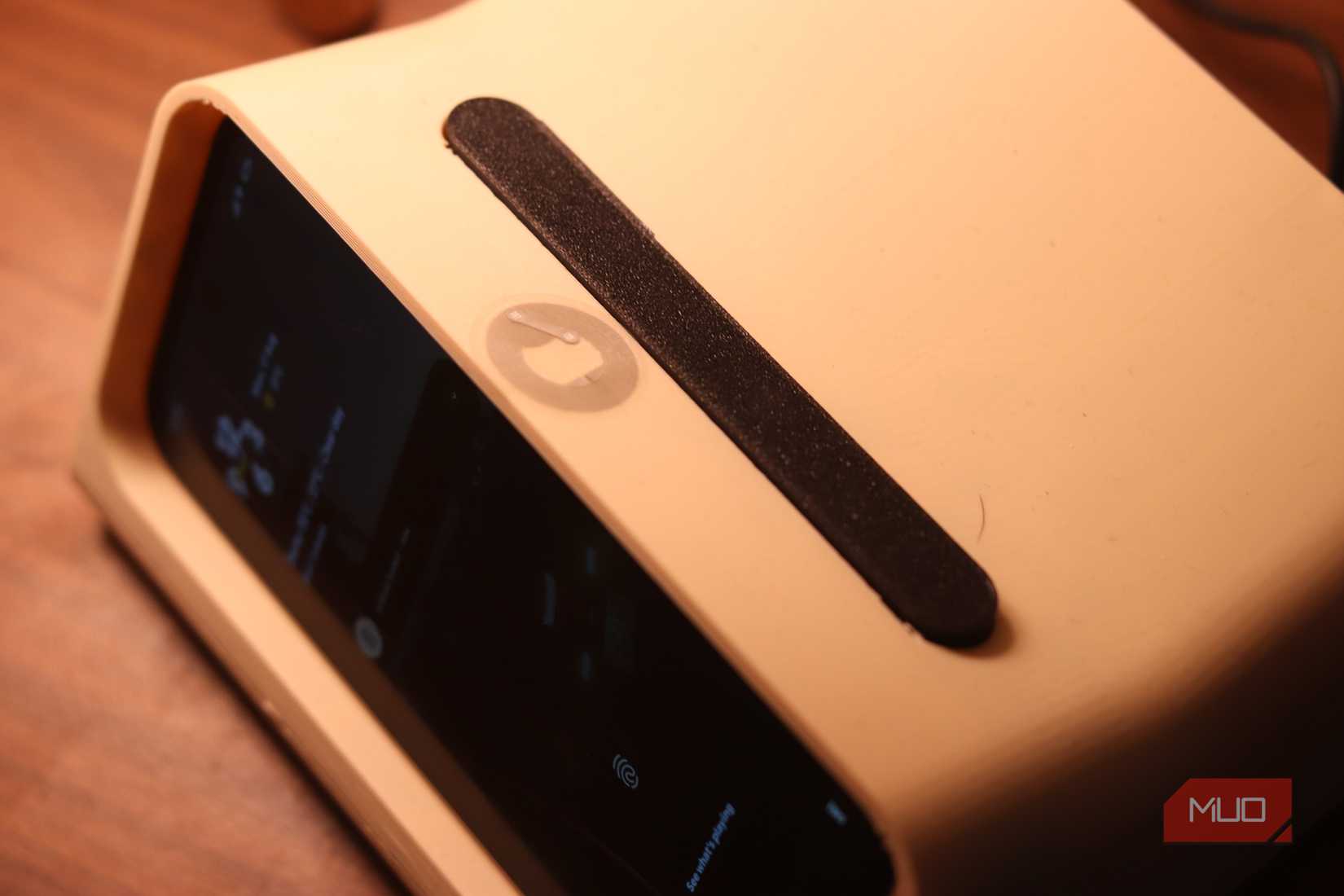 NFC sticker on bedside phone holder.