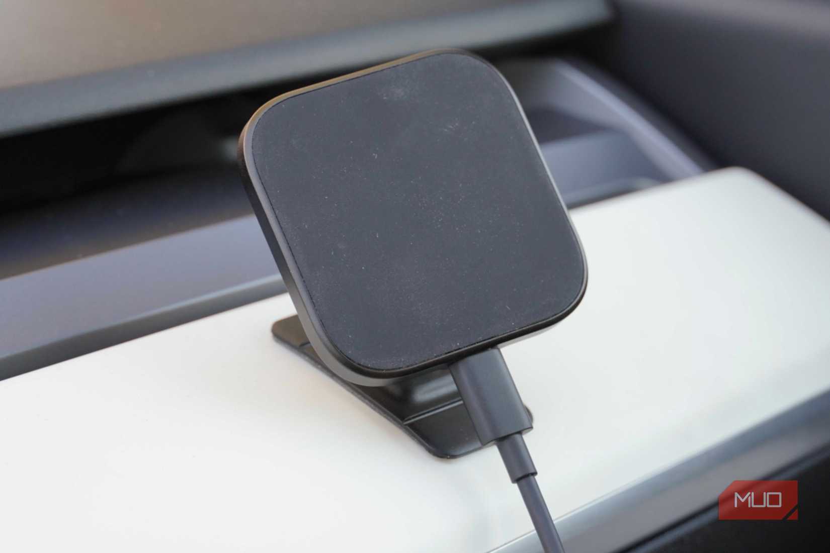 A third-party charging mount in a Tesla.