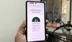 Phone in hand showing Google Messages settings