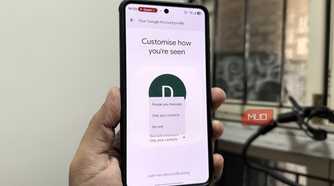 Phone in hand showing Google Messages settings