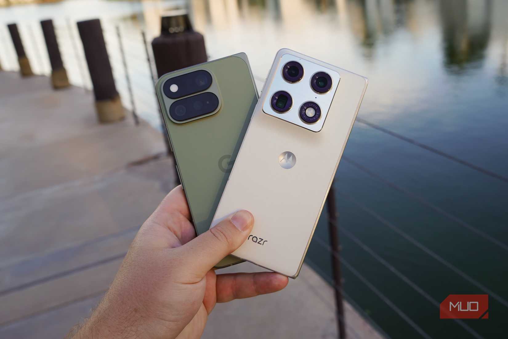The Pixel 11 Pro Fold and Razr Fold in the hand.