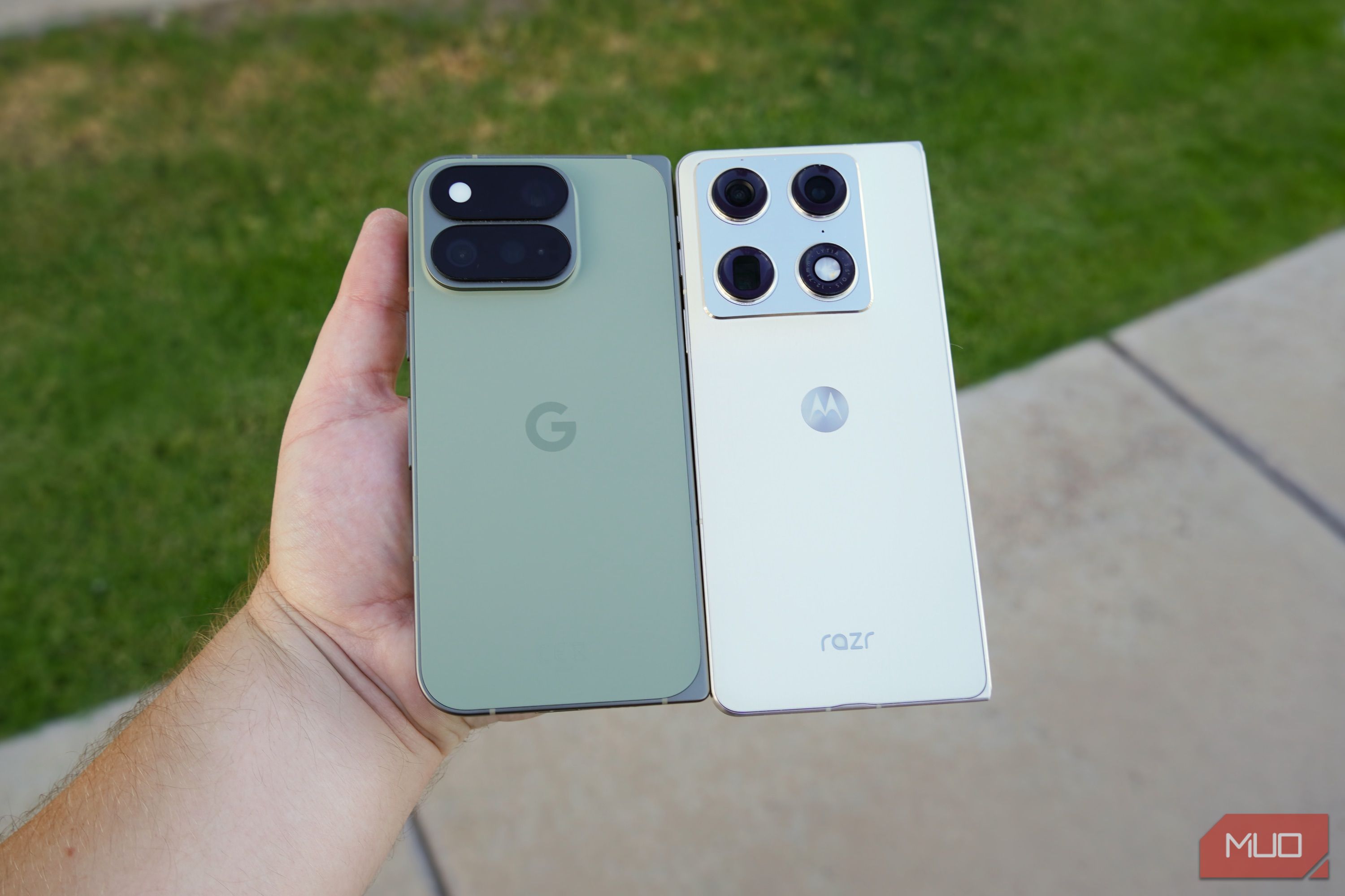The Pixel 11 Pro Fold and Razr Fold in the hand. 