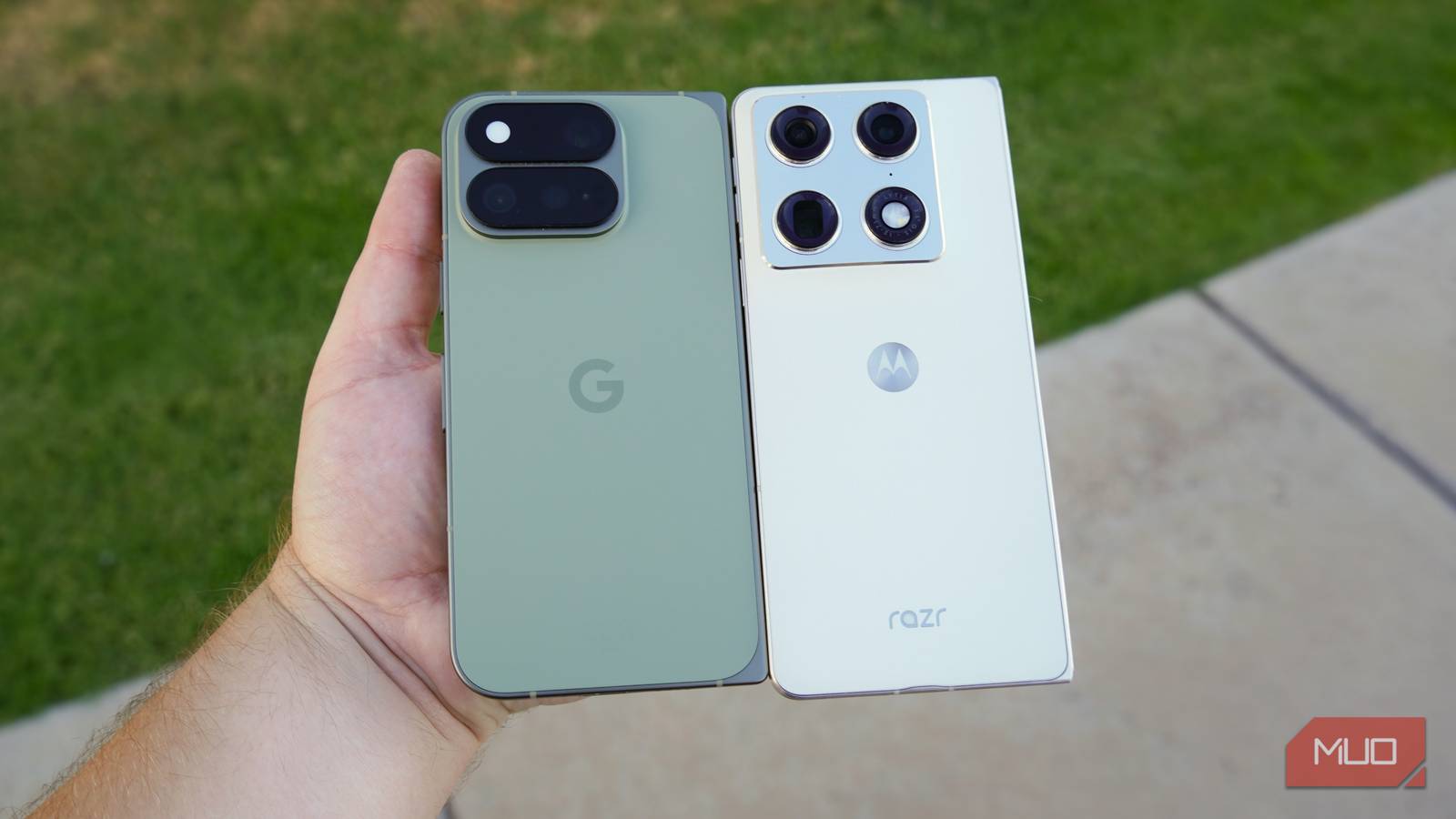 The Pixel 11 Pro Fold and Razr Fold in the hand. 