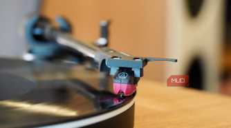 The turntable stylus on a record.