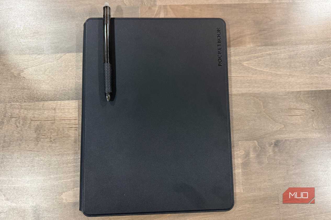 rocketbook pro 2.0 closed with black pen resting on cover