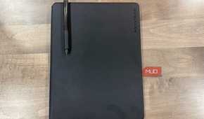 rocketbook pro 2.0 closed with black pen resting on cover