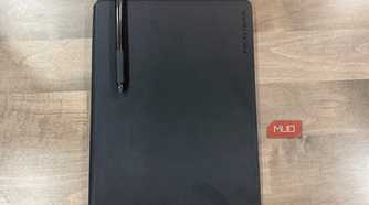rocketbook pro 2.0 closed with black pen resting on cover
