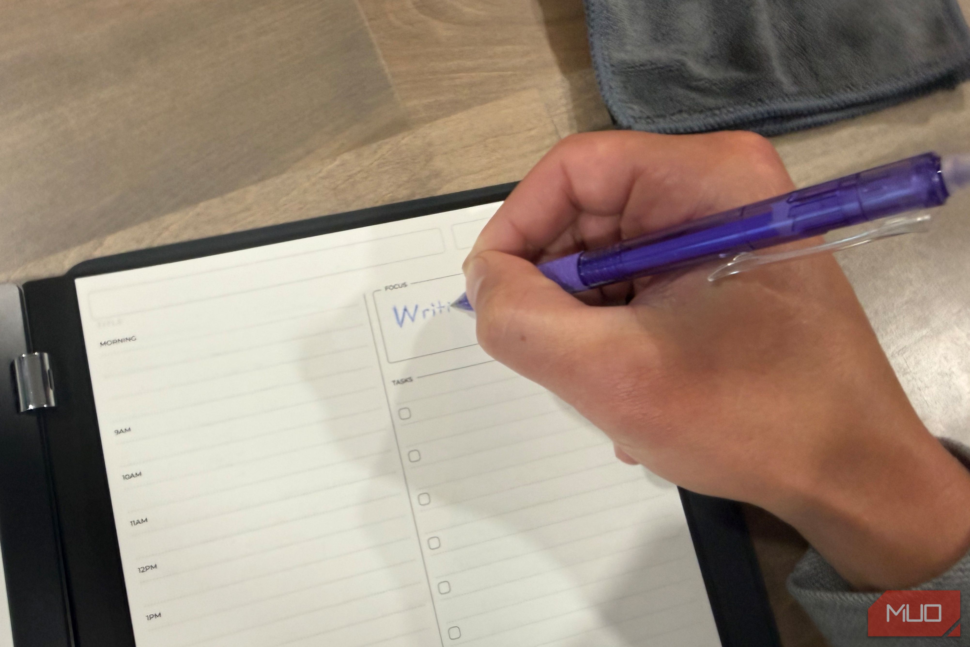 rocketbook pro 2.0 daily planner page being written on with purple pen