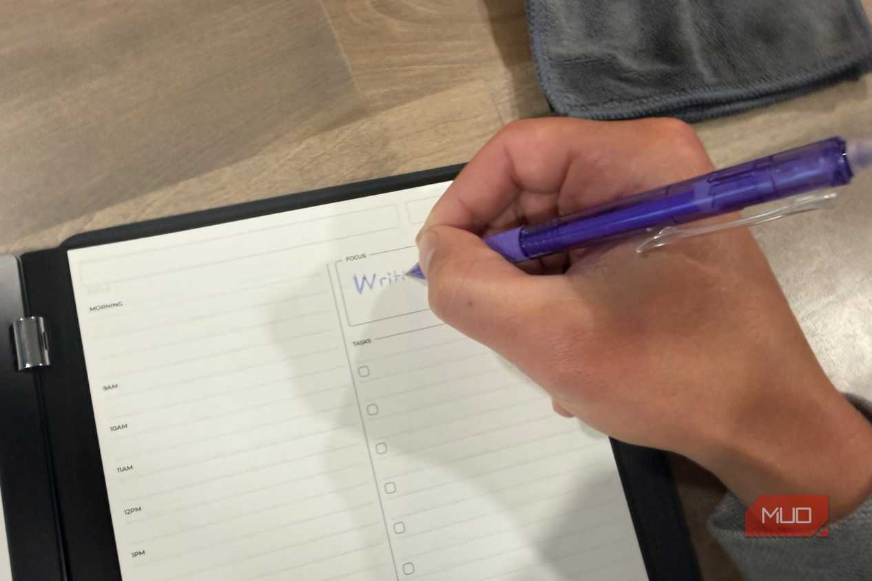 rocketbook pro 2.0 daily planner page being written on with purple pen