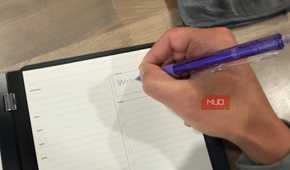 rocketbook pro 2.0 daily planner page being written on with purple pen
