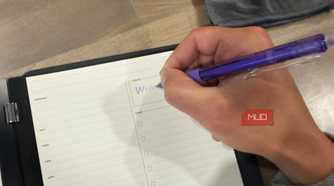 rocketbook pro 2.0 daily planner page being written on with purple pen