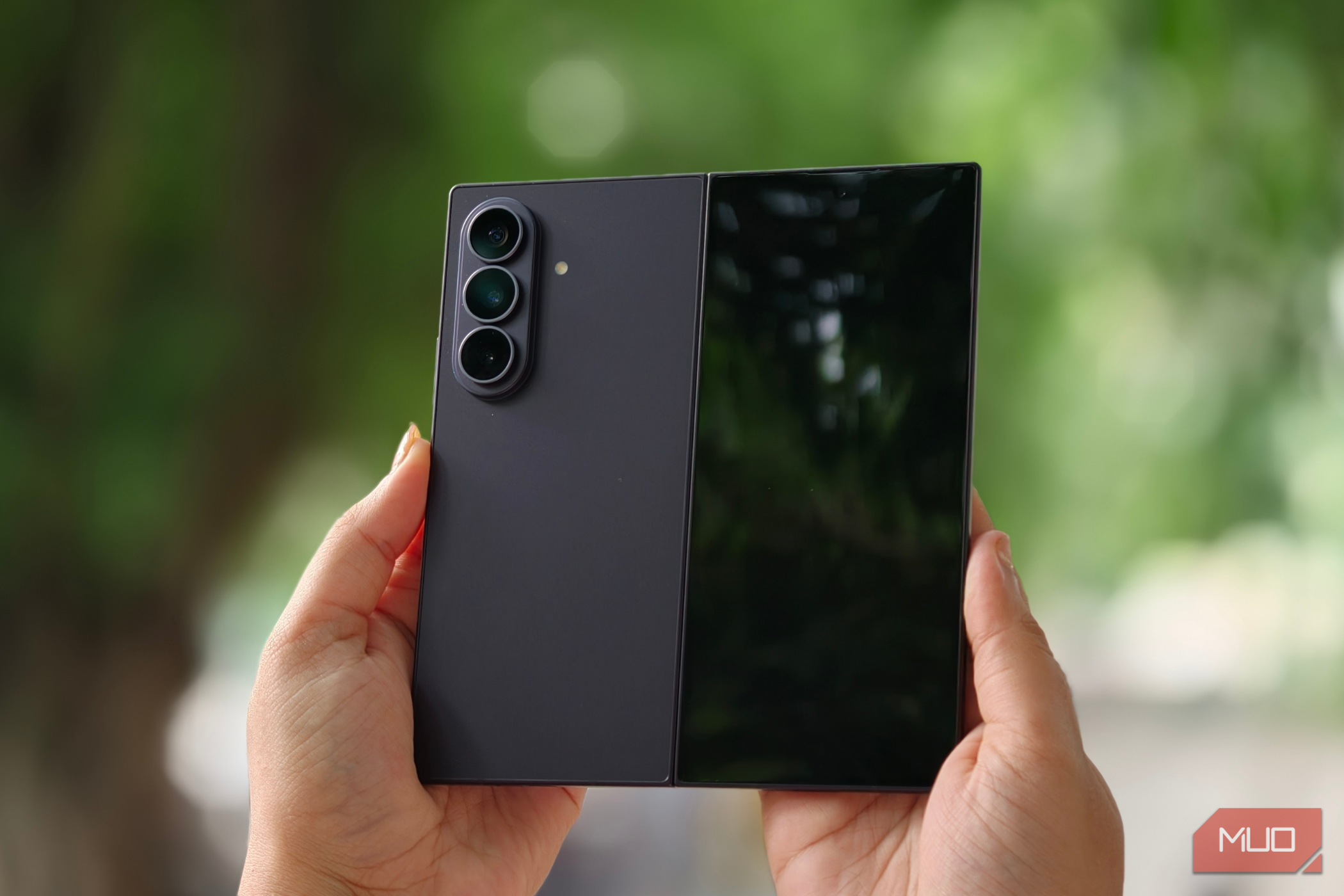 Samsung Galaxy Z Fold 8 Ultra with the cover display visible in a person's hand