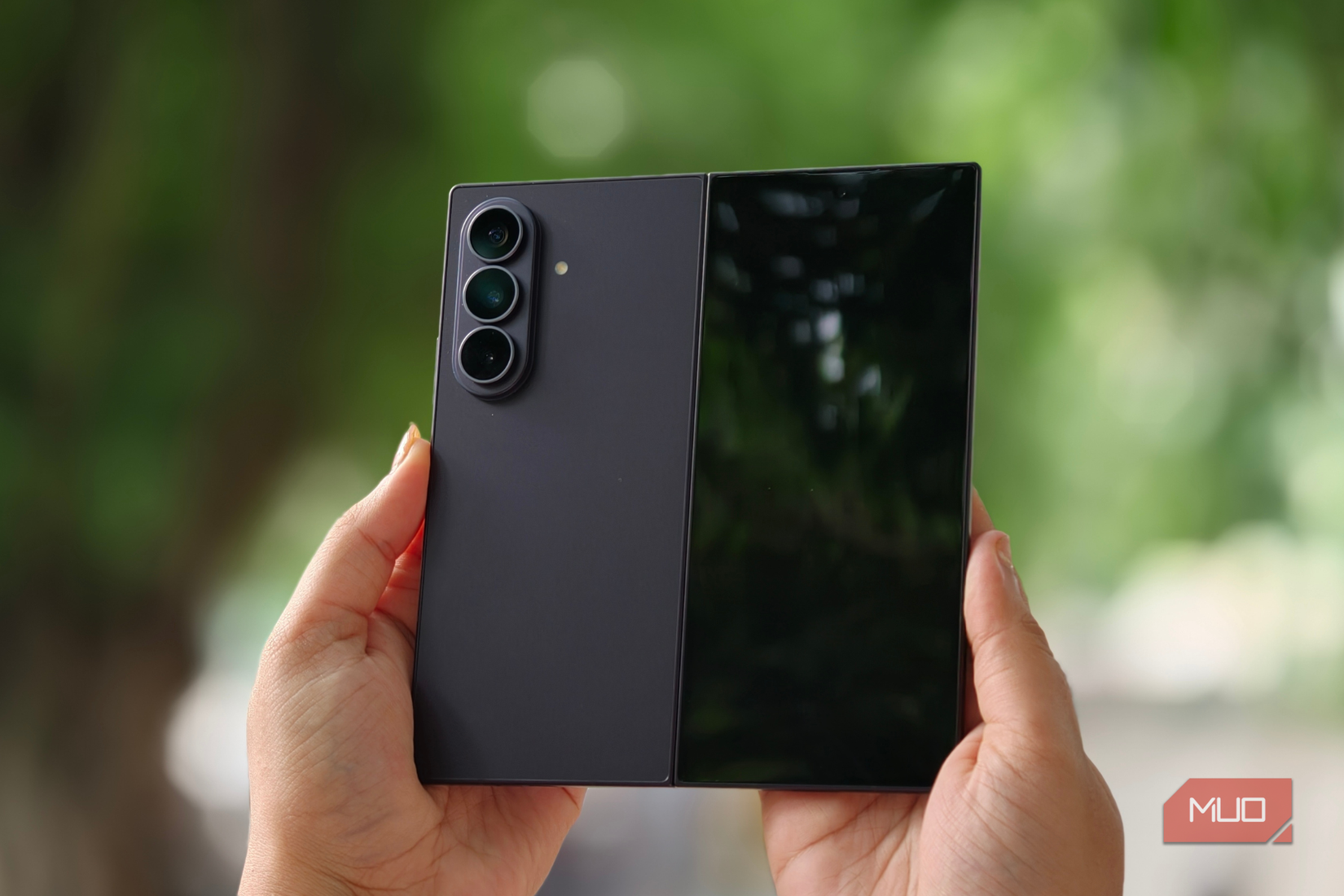 Samsung Galaxy Z Fold 8 Ultra with the cover display visible in a person's hand