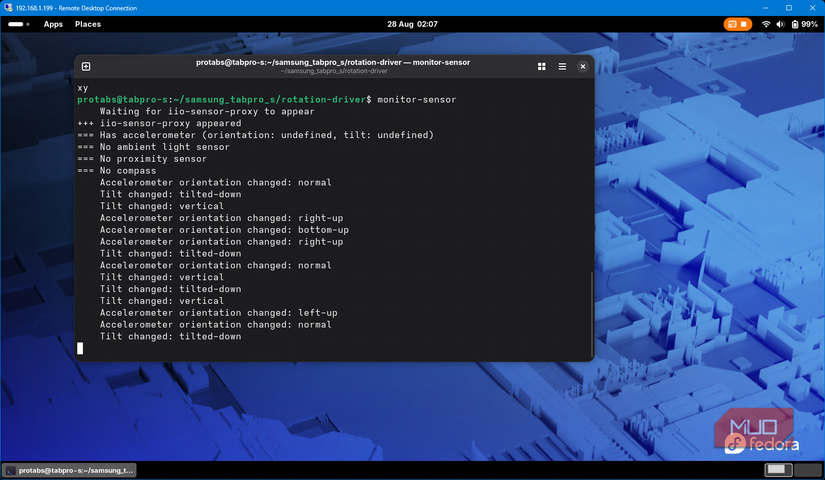 monitor-sensor running in terminal on Fedora Linux showing accelerometer data