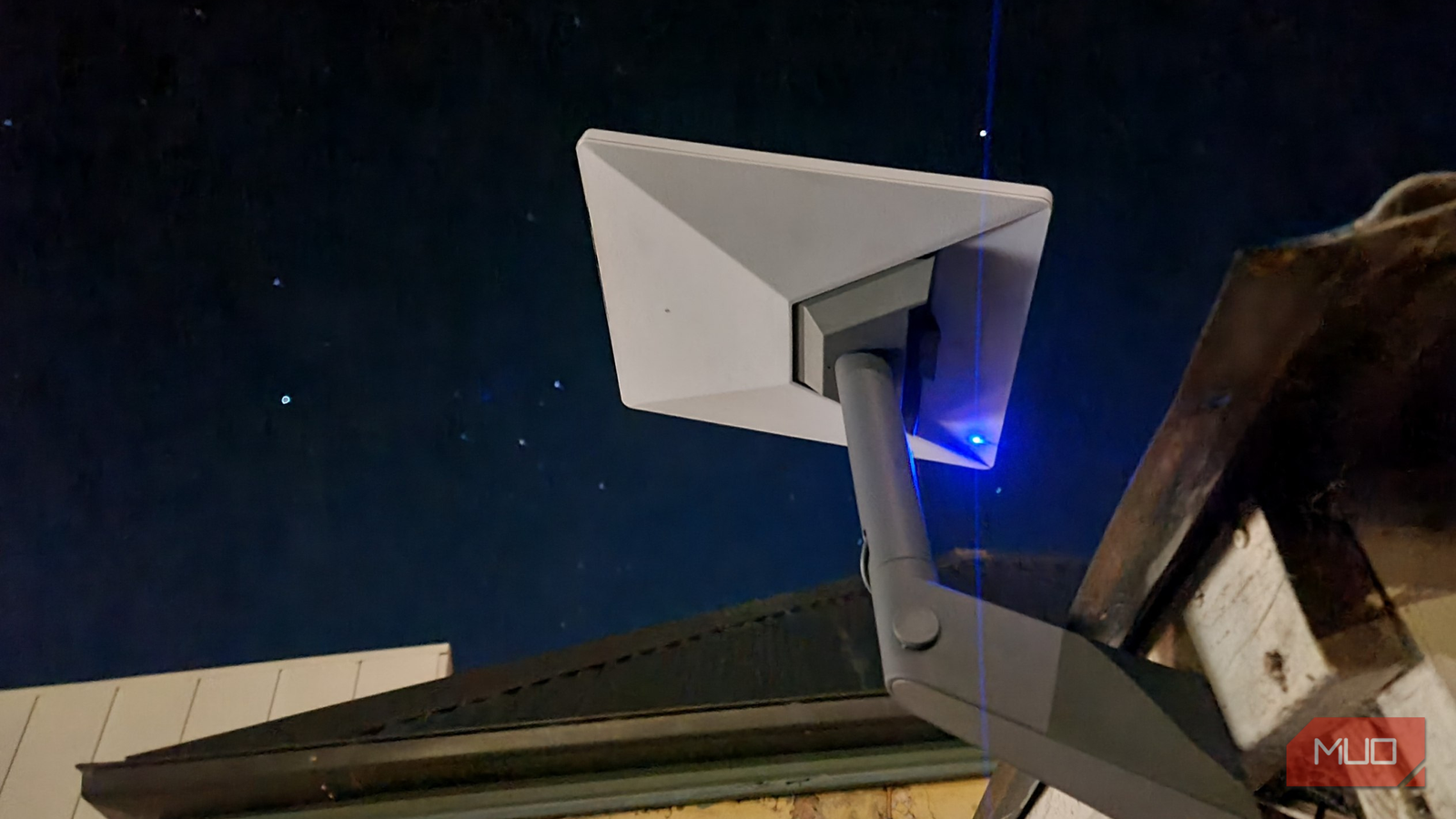 Starlink Mini dish under clear sky at night