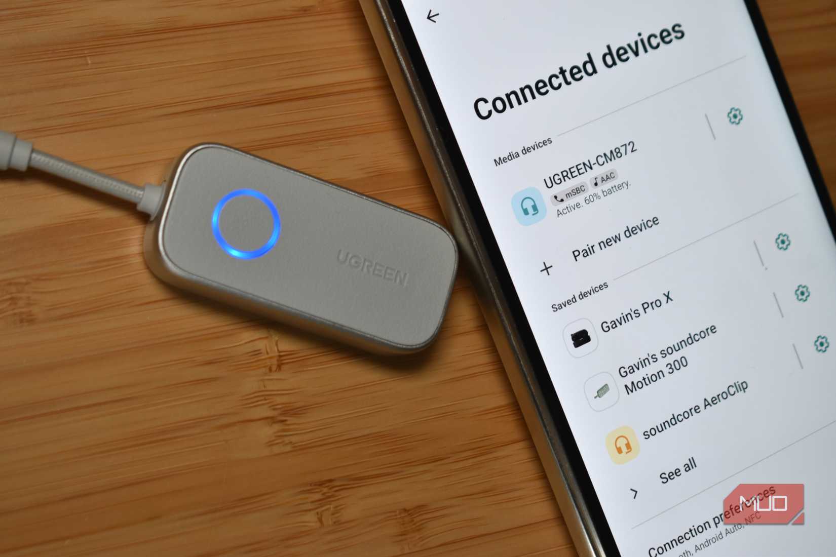 ugreen bluetooth 6 to 3.5mm adapter connected to smartphone.
