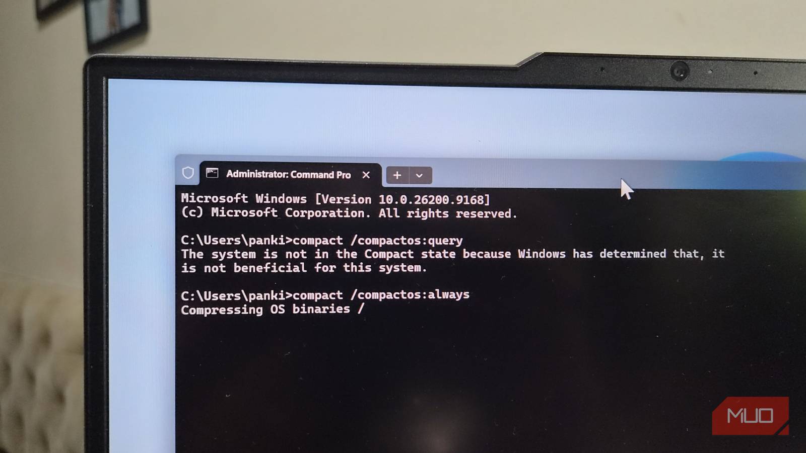 Windows laptop showing Compact OS command