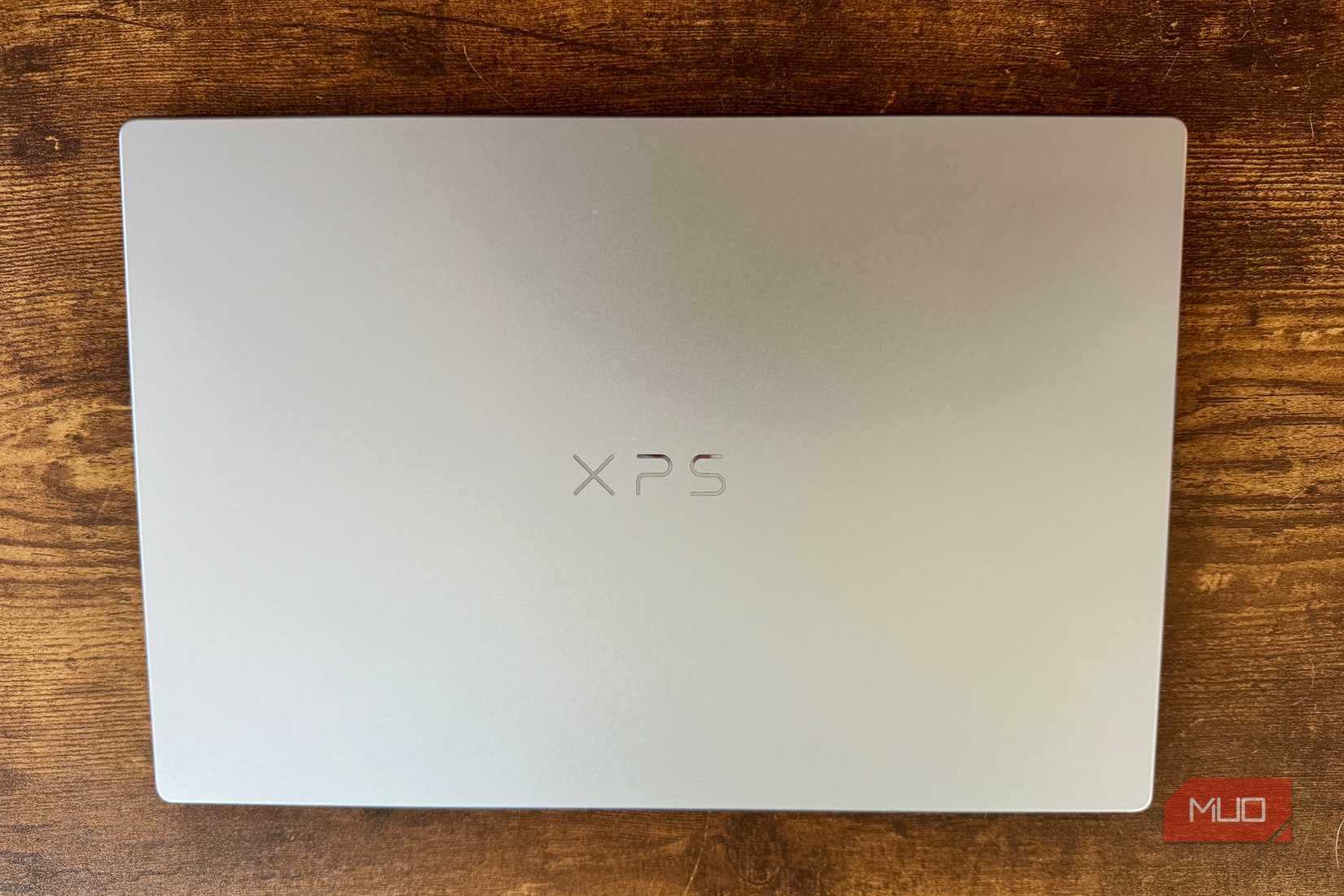 Dell XPS 13 closed on a coffee table