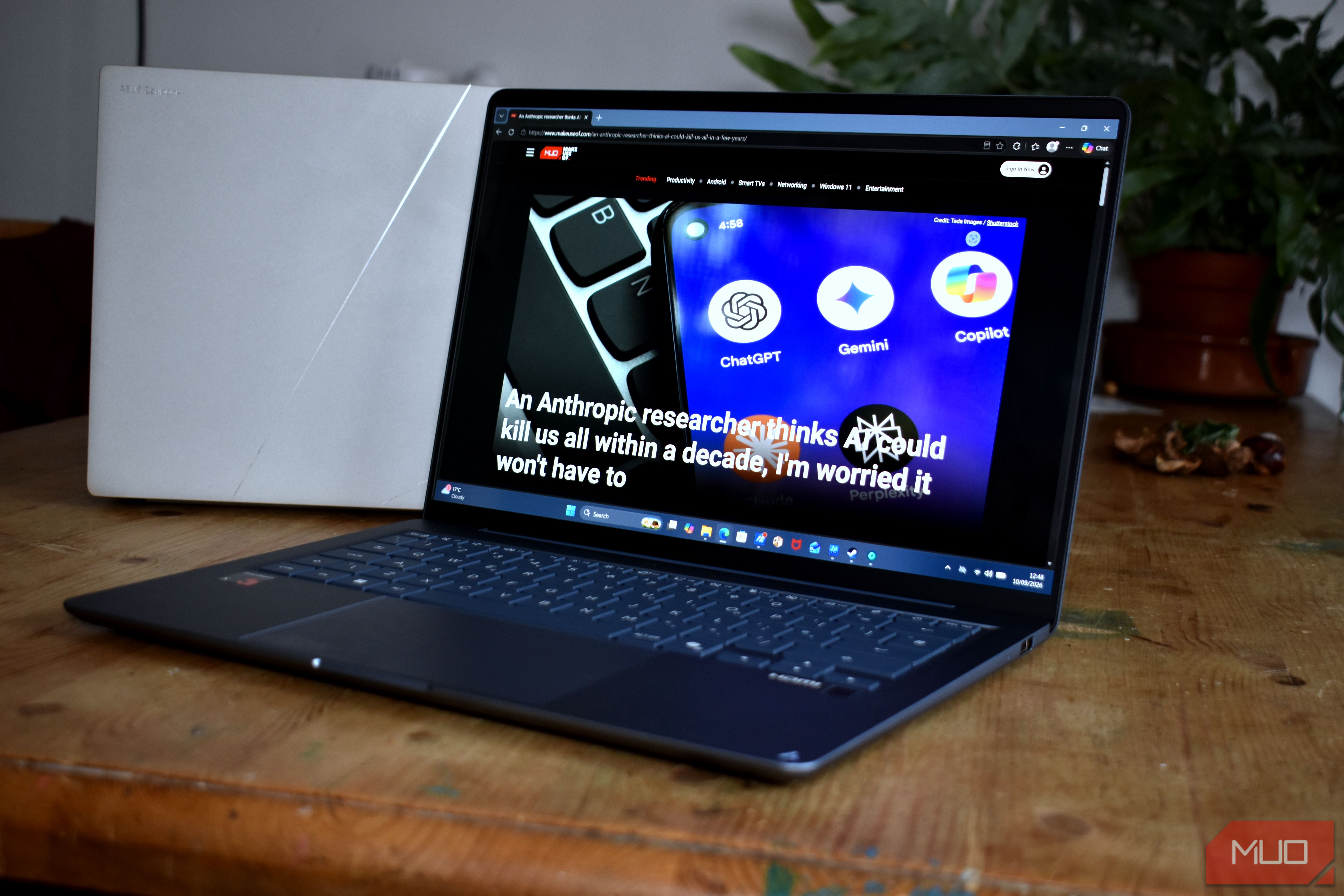 asus zenbook 14 ux3480qa on table front view.