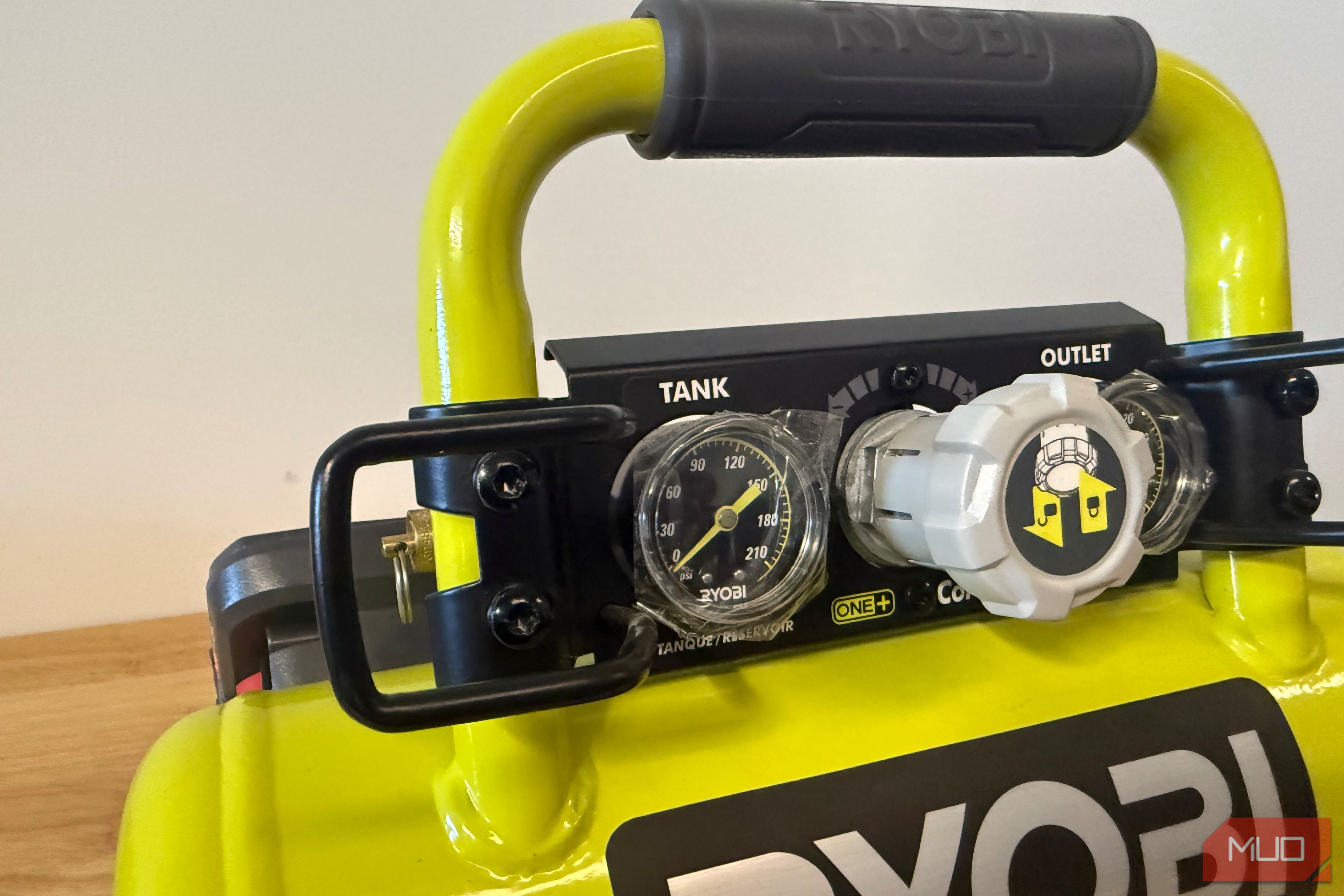 Close-up of Ryobi compressor gauges and pressure regulator