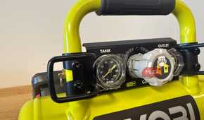 Close-up of Ryobi compressor gauges and pressure regulator