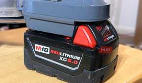 A Milwaukee M18 battery attached to the Dyson V8 vacuum.