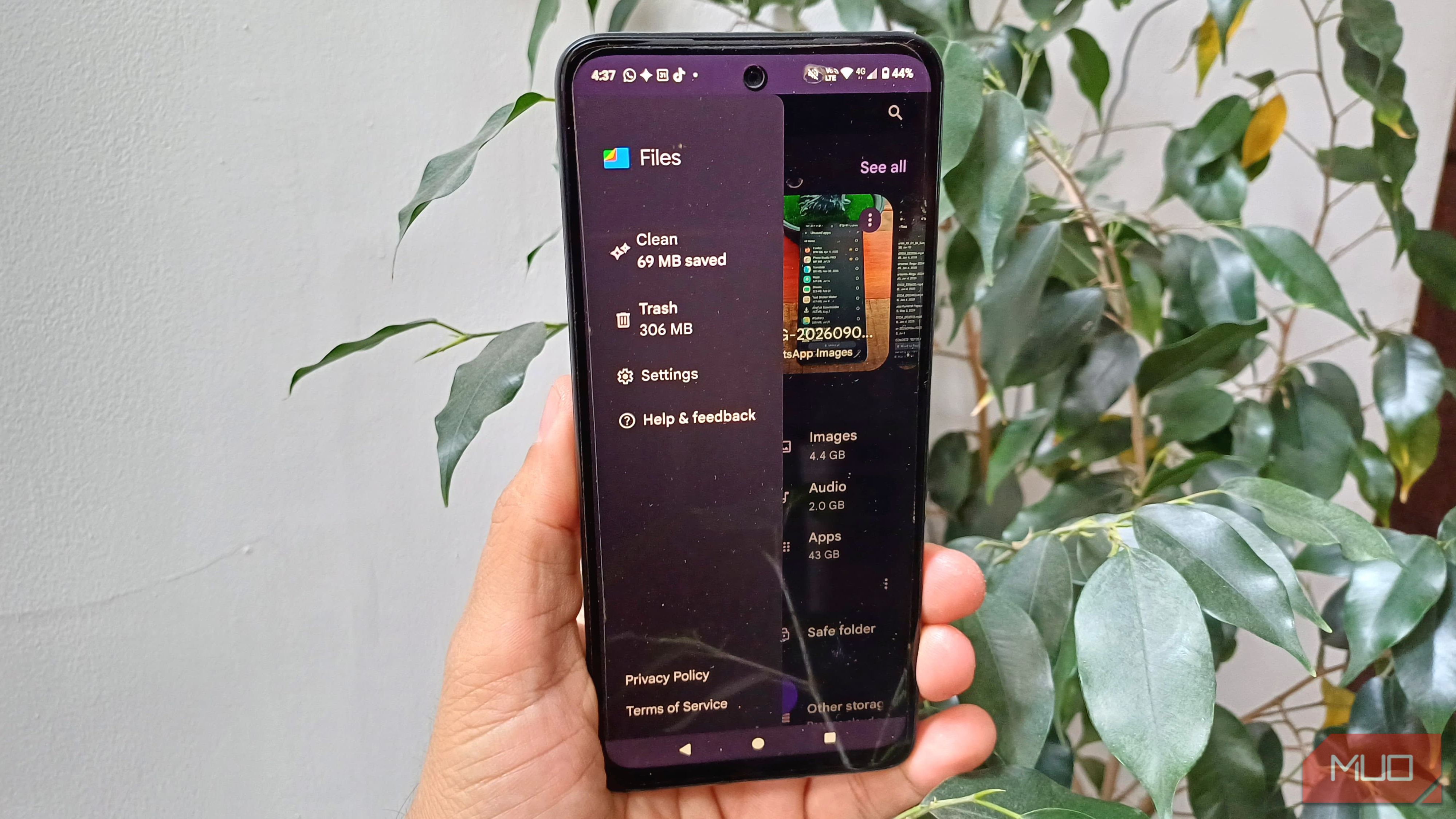 Files by Google side menu open on an Android phone, showing Clean, Trash, Settings, Help & feedback, and storage categories