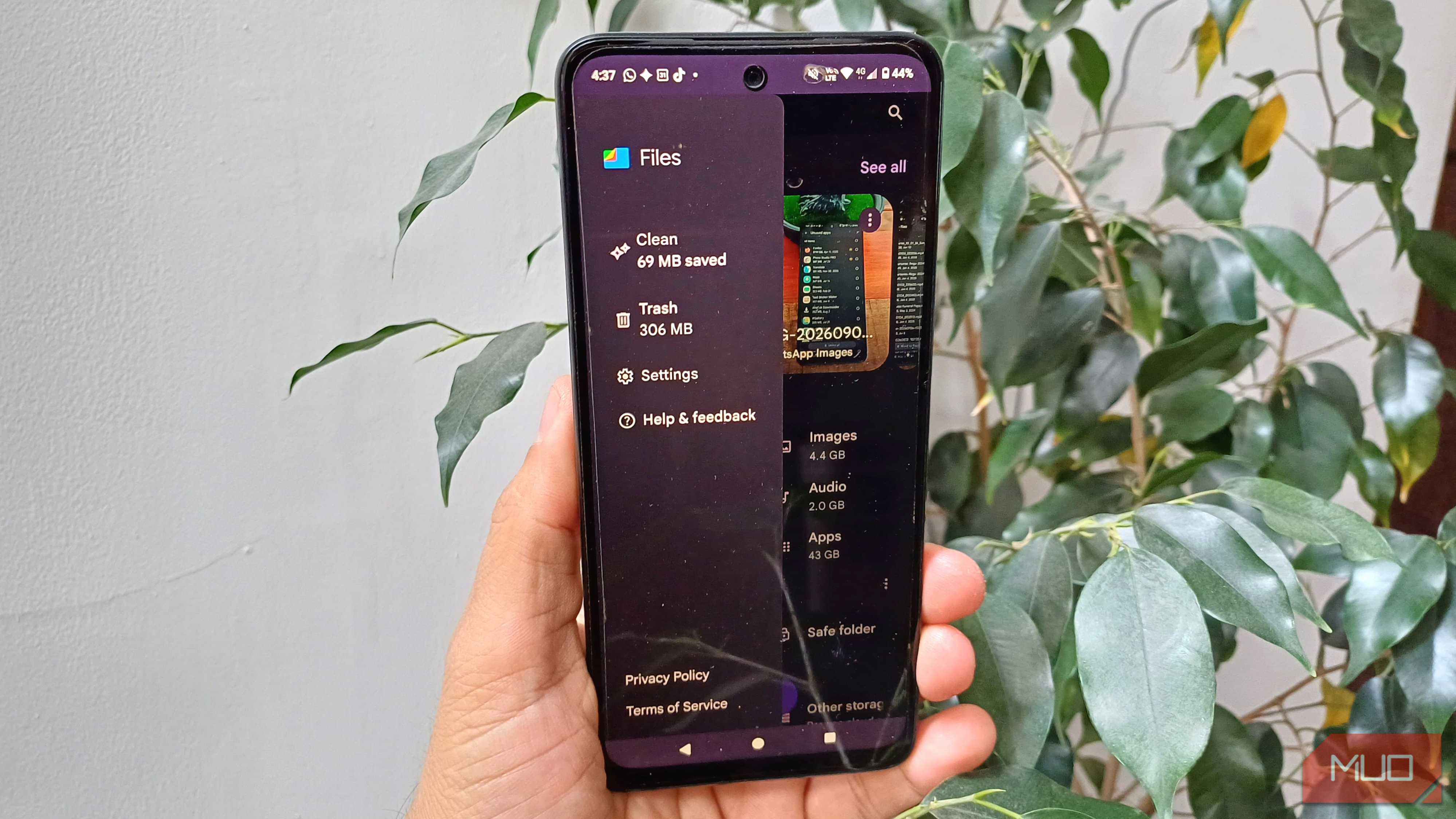 Files by Google side menu open on an Android phone, showing Clean, Trash, Settings, Help & feedback, and storage categories