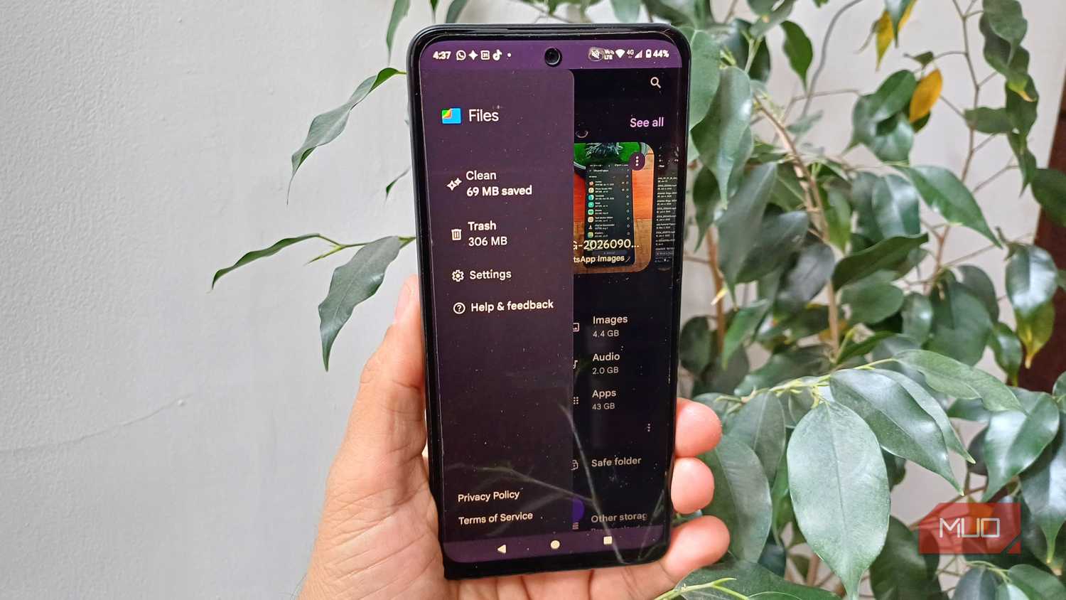 Files by Google side menu open on an Android phone, showing Clean, Trash, Settings, Help & feedback, and storage categories