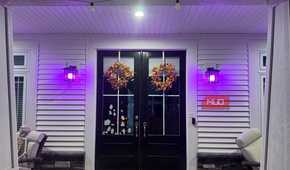 Front entry lit purple by Linkind smart bulbs at night