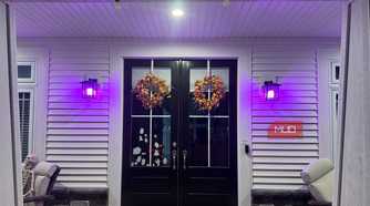 Front entry lit purple by Linkind smart bulbs at night