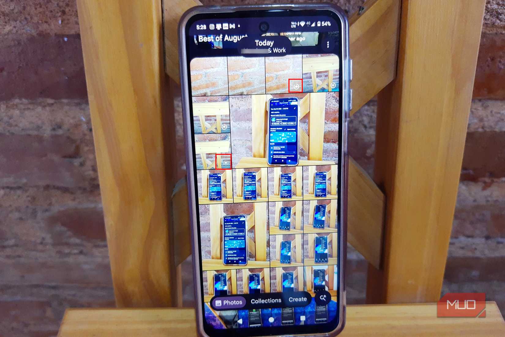 Android phone displaying a grid of photos in the Google Photos app